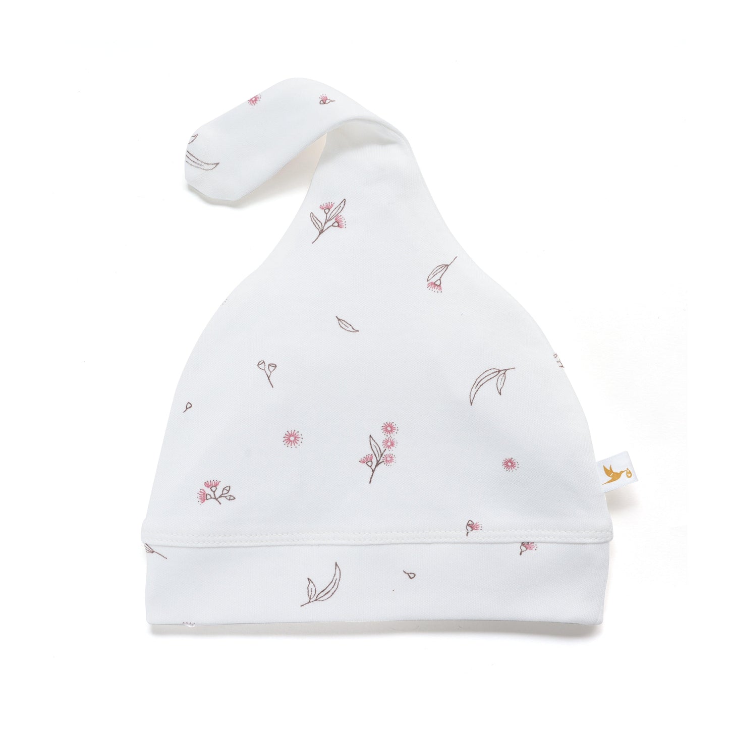 White baby knotted cap with delicate pink and brown floral prints on fabric