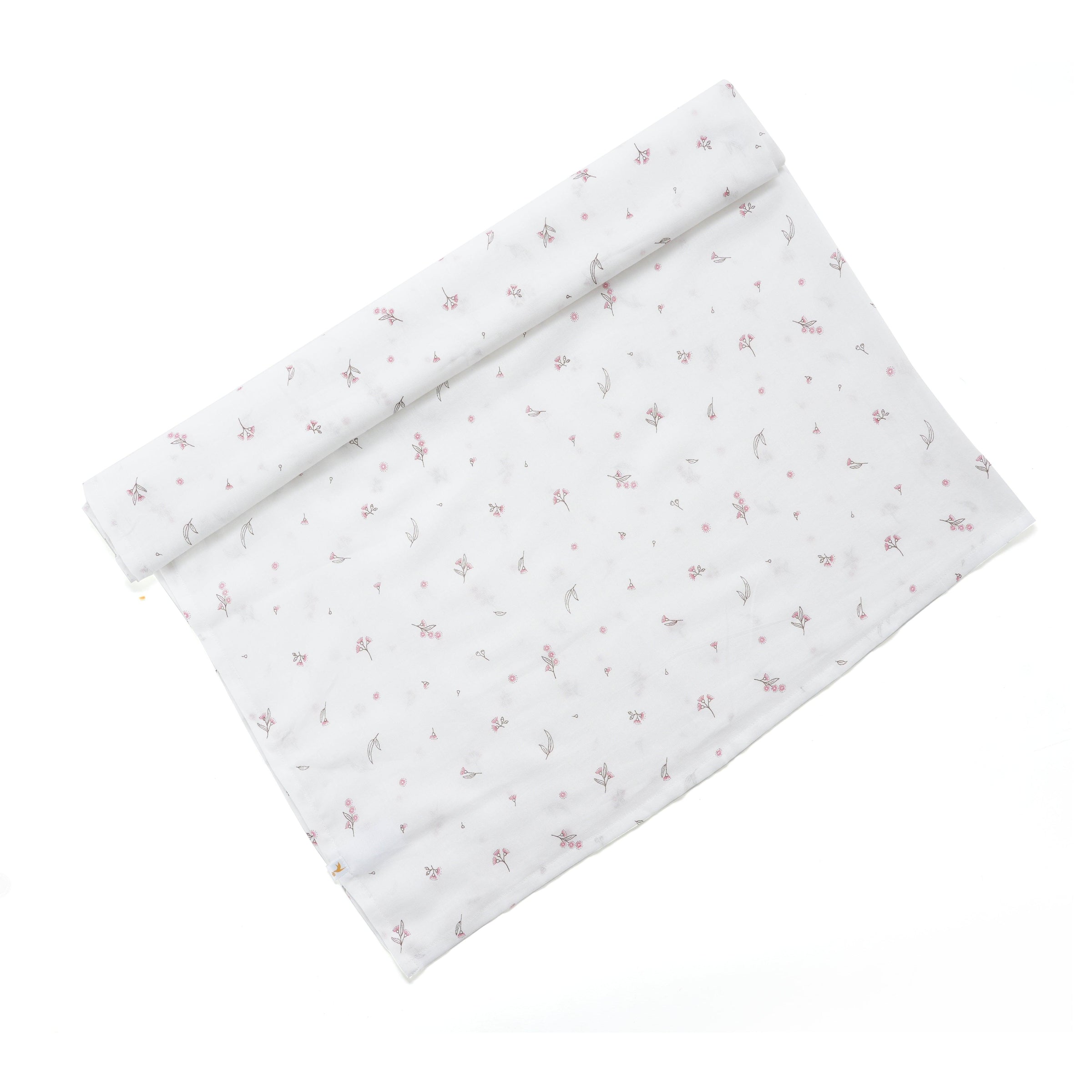 Rolled white baby swaddle blanket with small pink floral print fabric detail