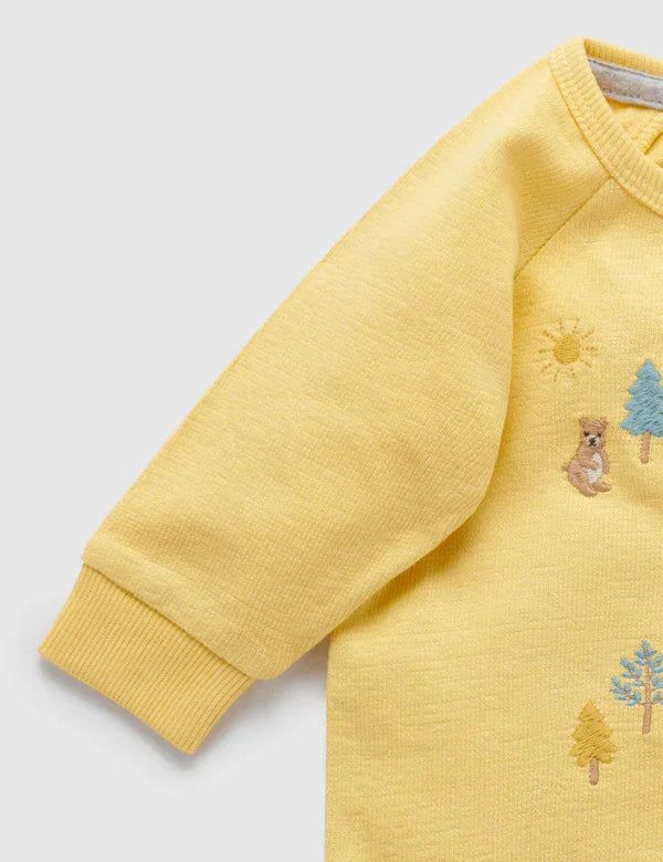 Yellow baby sweatshirt with embroidered bear, rabbit, trees, and sun details